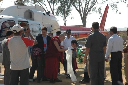 His Holiness the Dalai Lama receives a ceremonial welcome upon his arrival at Dhondhenling Tibetan settlement in Kollegal in South Indian state of Karnataka, on 17 February 2009. Mr Karma Sengye, representative of Dhondhenling Tibetan settlement, is seen offering Khatak to His Holiness. Digntaries from the local Indian administration, including Mr Nadendra R, member of legislative assembly, deputy commissioner, superintendent of police arrived at the helipad to receive His Holiness - Photos:Jigme Tsering, tibetonline.tv