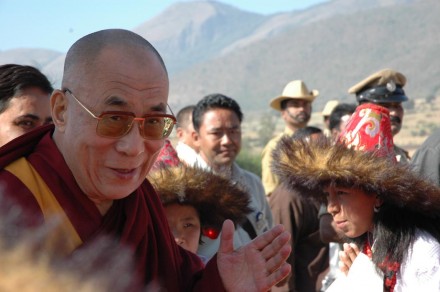 His Holiness the Dalai Lama greets Tibetan school children in traditional attire