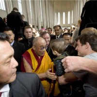 His Holiness the Dalai Lama being greeted by the public at the inter-faith prayer gathering. Photo by Ragnar Axelsson