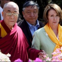 In this file photo His Holiness the Dalai Lama (L) welcomes US House of Representatives Speaker Nancy Pelosi (R) as she arrives at his Palace Temple in Dharamsala on 21 March 2008/AFP