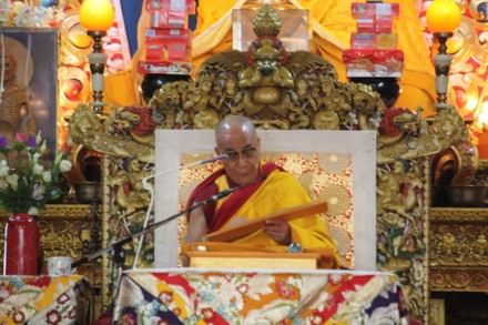  His Holiness the Dalai Lama reads texts from a scripture on the first day of a three-day Buddhist sermon  at Tsulagkhang, main temple, in Dharamsala, India, on 15 September 2009/Photo:Sangjay Kyap