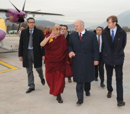 His Holiness the Dalai Lama arrives in Bolzano, Italy and received by President Luis Durnwalder (center R) of South Tyrol in Bolzano airport.