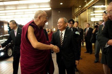 Makino Seishu (R) Member of Parliament, greets His Holiness the Dalai Lama (L) outside the  Royal Park Hotel.