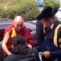  His Holiness the Dalai Lama is greeted by University of Tasmania Vice Chancellor Daryl Le Grew, this morning. Picture: Sally Glaetzer