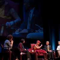 His Holiness the Dalai Lama and panel members holding conference on 'Scientific Explorations of Compassion and Altruism'