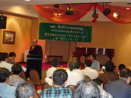 A speaker talks during the cultural exchange meet between the Chinese and Tibetan participants held in