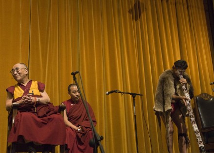 His Holiness the Dalai Lama enjoys a performance by an aborigine at an event in Perth, Australia, on 