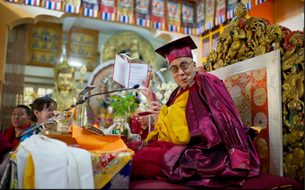 His Holiness wearing a cap and gown after receiving an honorary title, Professor Emeritus at the Tsuklakhang. (Tenzin Choejor, OHHDL)